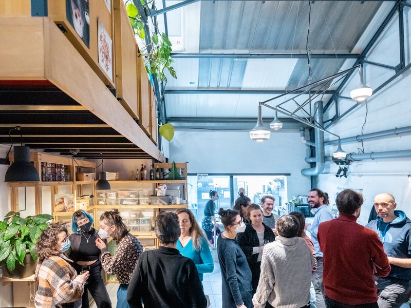 The REFLOW consortium meeting at Volumes, Paris, 2022: people under the wooden mezzanine